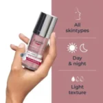 Hand holding Eucerin Anti-Pigment Dual Serum, bright pink bottle with silver cap, product features: suitable for all skin types, day and night use, light texture, dermatological skincare for pigmentation and dark spots